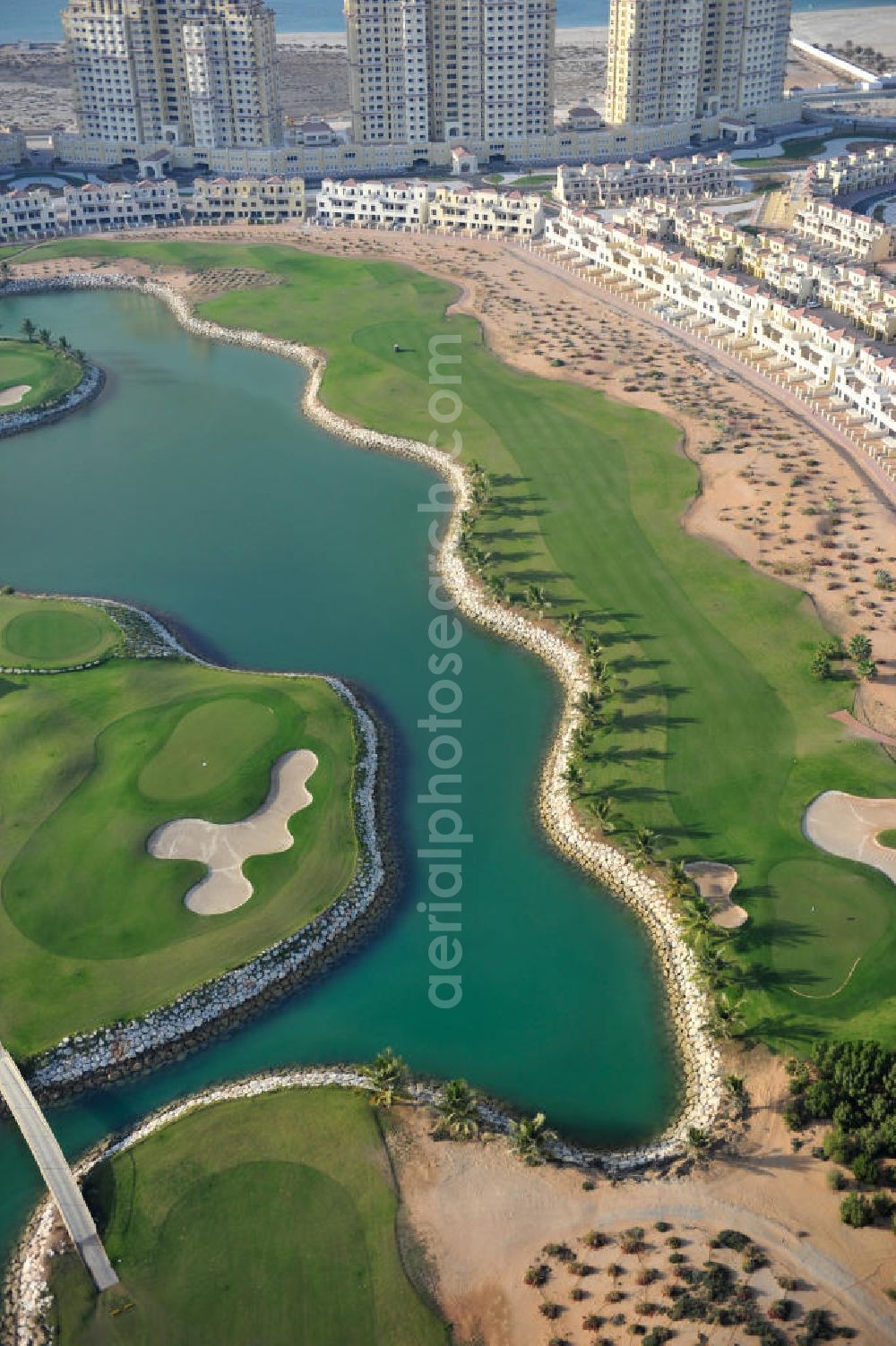 Ras Al Khaimah from above - Complex of the Al Hamra Golf Club in the arab emirate Ras Al Khaimah. The golf club is part of the Al Hamra Village Project, the second largest construction project of Ras Al Khaimah. The project is realized by the state-owned company Al Hamra Real Estate