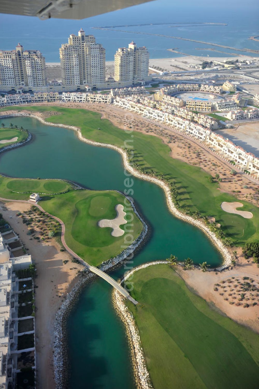 Aerial image Ras Al Khaimah - Complex of the Al Hamra Golf Club in the arab emirate Ras Al Khaimah. The golf club is part of the Al Hamra Village Project, the second largest construction project of Ras Al Khaimah. The project is realized by the state-owned company Al Hamra Real Estate