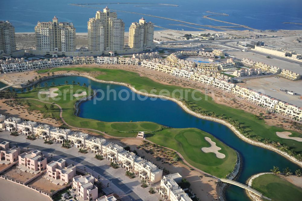 Aerial photograph Ras Al Khaimah - Complex of the Al Hamra Golf Club in the arab emirate Ras Al Khaimah. The golf club is part of the Al Hamra Village Project, the second largest construction project of Ras Al Khaimah. The project is realized by the state-owned company Al Hamra Real Estate