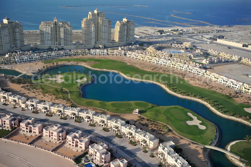 Ras Al Khaimah from above - Complex of the Al Hamra Golf Club in the arab emirate Ras Al Khaimah. The golf club is part of the Al Hamra Village Project, the second largest construction project of Ras Al Khaimah. The project is realized by the state-owned company Al Hamra Real Estate