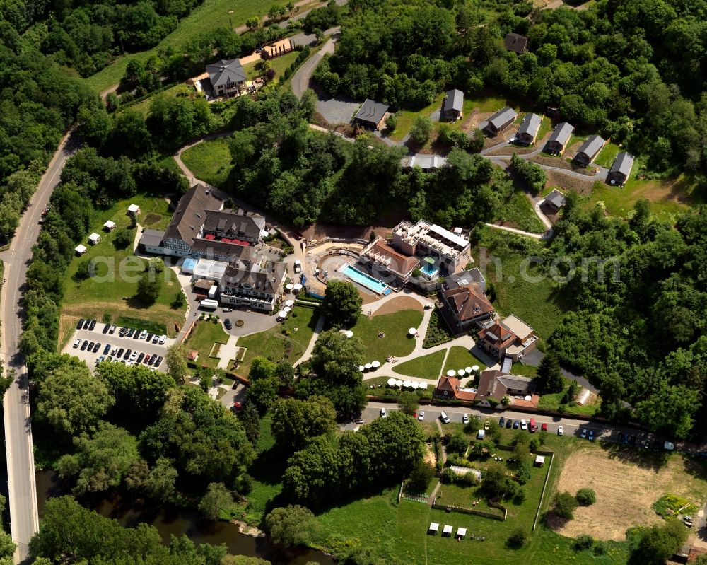 Bad Sobernheim from above - Park and hotel compound of the BollAnts Hotel of Bad Sobernheim in the state of Rhineland-Palatinate. Bad Sobernheim is a borough and municipiality in the county district of Bad Kreuznach. It is an official spa and health resort. The compound in the South of the town on the Nahe river includes the hotel, a swimming pool, a spa and wellness facilities