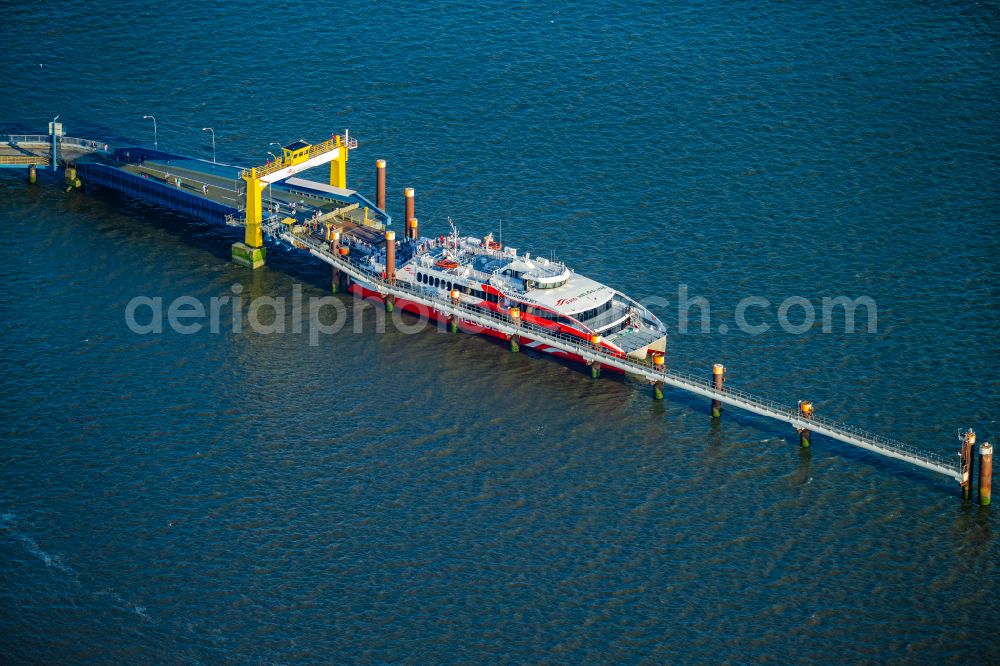 Aerial image Brunsbüttel - Docking ferry ship Halunder Jet at the Elbe pier in Brunsbuettel in the state Schleswig-Holstein, Germany