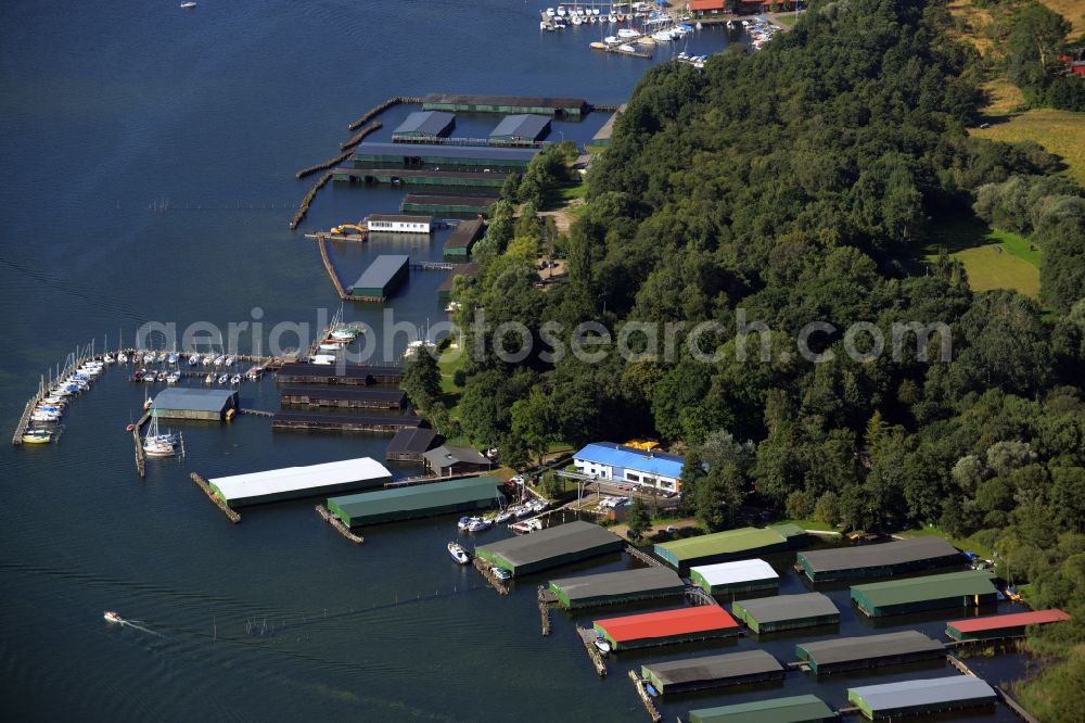 Waren (Müritz) from above - Boat marina with docks and moorings on the shore area of lake Binnenmueritz in Waren (Mueritz) in the state Mecklenburg - Western Pomerania. The docks are located in the South of the town centre