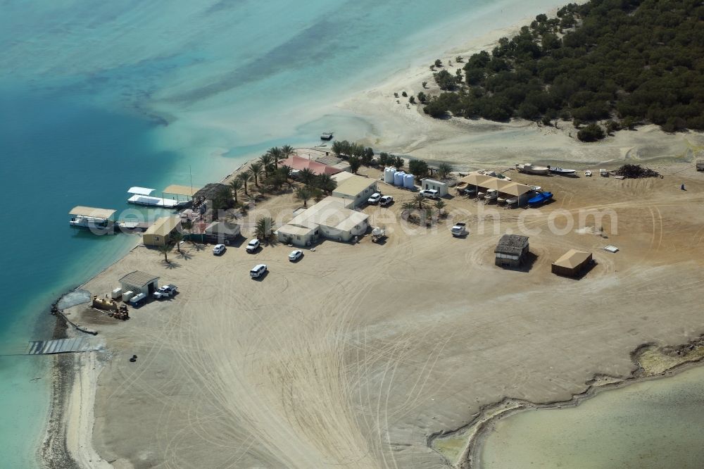 Abu Dhabi from above - Boat marina with docks and moorings on the shore area of Khor Laffan in Abu Dhabi in United Arab Emirates. Starting Point for boat tours in the canals and mangroves