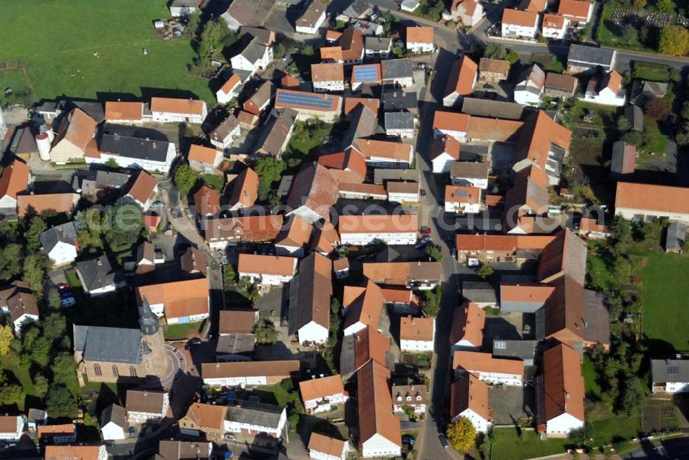 Aerial photograph Willingshausen-Wasenberg - Blick auf die ev.-ref. Kirchengemeinde Wasenberg. Sie hat knapp 1400 Mitglieder. Das Wahrzeichen des Dorfes ist die mit ihrem 47 Meter hohen Turm weithin sichtbare Kirche, die 1857 von dem namhaften Architekten Ungewitter im neugotischen Stil erbaut wurde.