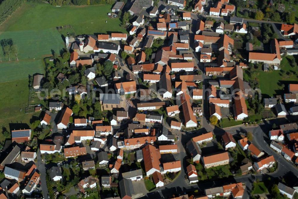 Willingshausen-Wasenberg from above - Blick auf die ev.-ref. Kirchengemeinde Wasenberg. Sie hat knapp 1400 Mitglieder. Das Wahrzeichen des Dorfes ist die mit ihrem 47 Meter hohen Turm weithin sichtbare Kirche, die 1857 von dem namhaften Architekten Ungewitter im neugotischen Stil erbaut wurde.