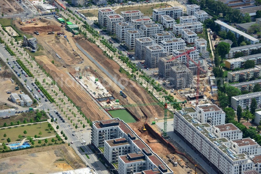 Aerial photograph Frankfurt am Main - View of the Europaviertel quarter in the Gallus part of Frankfurt in the state of Hesse. The quarter is a new downtown district on site of the former main freight yard in the Gallus part of the town. It was started in 2005 and the first high rise was opened in 2006. It will be completed in 2019 and include office buildings, hotels, appartment buildings, a school and social infrastructure such as parks and shopping facilities. Symmetrically ordered residential buildings are being developed in the South of Europagarten