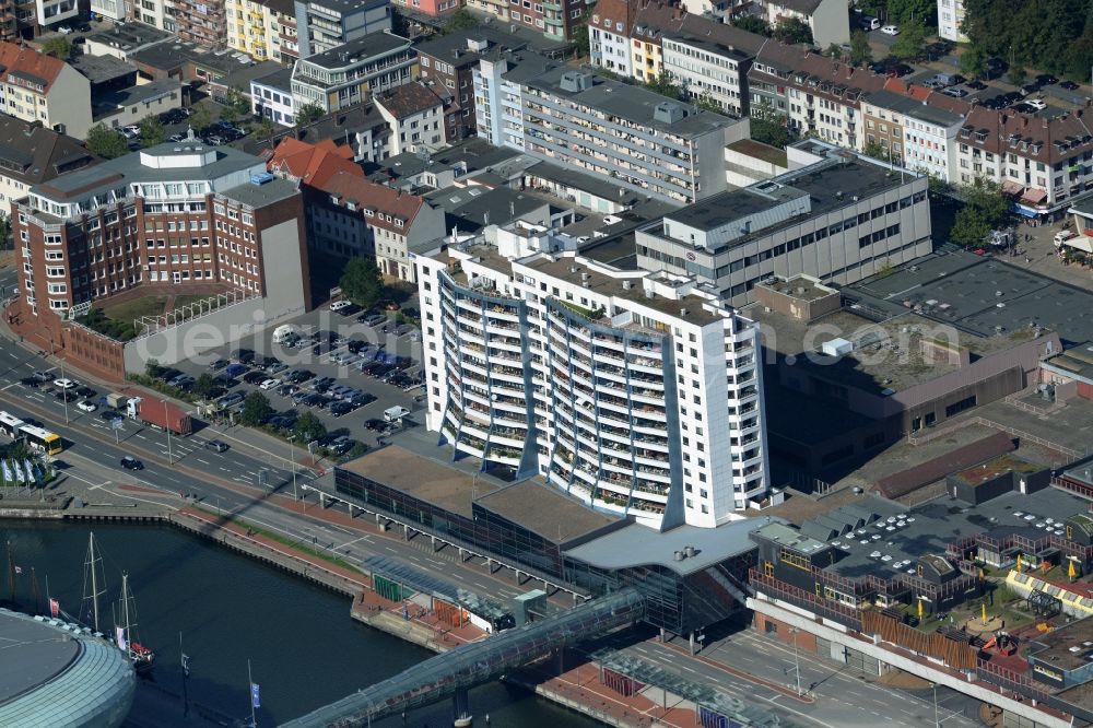 Aerial image Bremerhaven - Apartment high-rise in Bremerhaven in the state of Bremen. The building with the white front and balconies is located on the old harbour