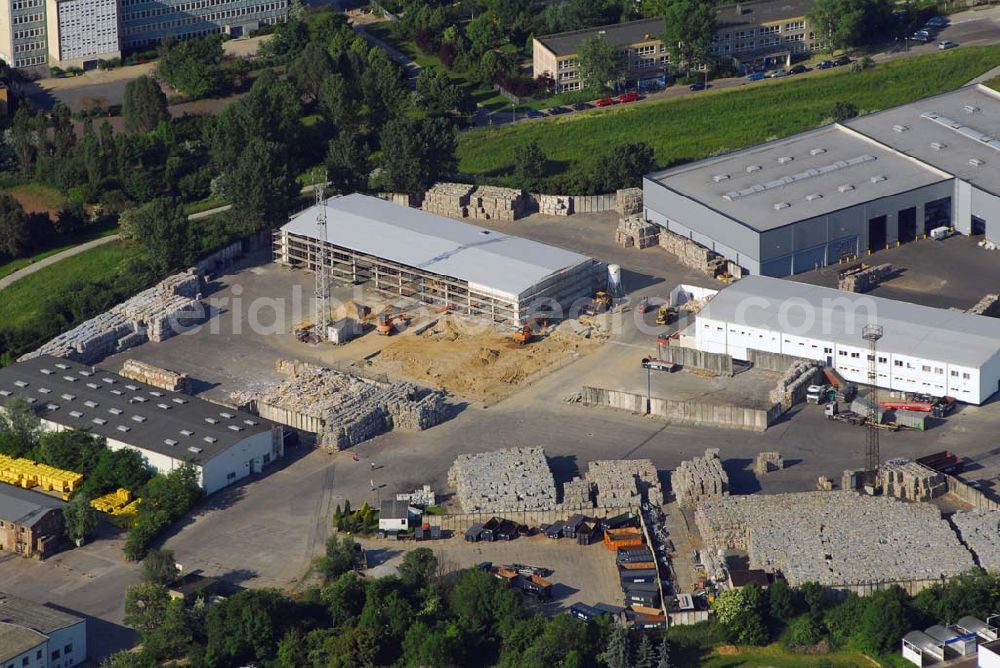 Berlin from above - Blick auf das Areal des ALBA-Betriebshofes an der B1 in Berlin-Mahlsdorf. Die ALBA AG betreibt Recyclinganlagen für die Wiederaufbereitung von Kunststoffen, Leichtverpackungen, Kühlgeräten sowie von Pappe/Papier und Glas. 2005 errichtete die ALBA AG am Westrand ihres Geländes in Berlin-Mahlsdorf angrenzend an den Berliner Balkon die modernste Recyclinganlage Europas