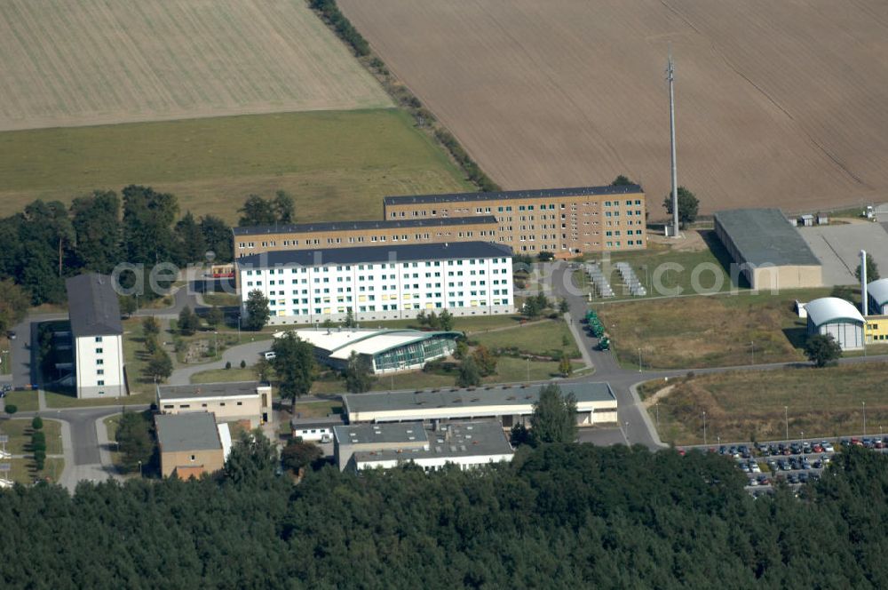 Aerial image Ahrensfelde - Blick auf das Areal der Bundespolizei-Fliegerstaffel Blumberg an der Neuer Schwanebecker Weg 3 in 16356 Ahrensfelde. Auf dem Gelände des Helikopterlandeplatzes am Berliner Stadtrand sind auch Maschinen der Regierungsfliegerstaffel stationiert. Am Standort erfolgt in den neu errichteten Hangars auch die Wartung und Reparatur der Flugtechnik.