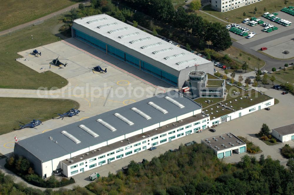 Ahrensfelde from the bird's eye view: Blick auf das Areal der Bundespolizei-Fliegerstaffel Blumberg an der Neuer Schwanebecker Weg 3 in 16356 Ahrensfelde. Auf dem Gelände des Helikopterlandeplatzes am Berliner Stadtrand sind auch Maschinen der Regierungsfliegerstaffel stationiert. Am Standort erfolgt in den neu errichteten Hangars auch die Wartung und Reparatur der Flugtechnik.