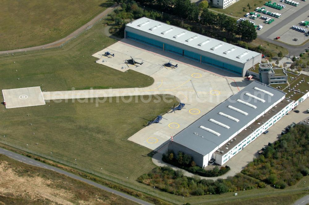 Ahrensfelde from the bird's eye view: Blick auf das Areal der Bundespolizei-Fliegerstaffel Blumberg an der Neuer Schwanebecker Weg 3 in 16356 Ahrensfelde. Auf dem Gelände des Helikopterlandeplatzes am Berliner Stadtrand sind auch Maschinen der Regierungsfliegerstaffel stationiert. Am Standort erfolgt in den neu errichteten Hangars auch die Wartung und Reparatur der Flugtechnik.