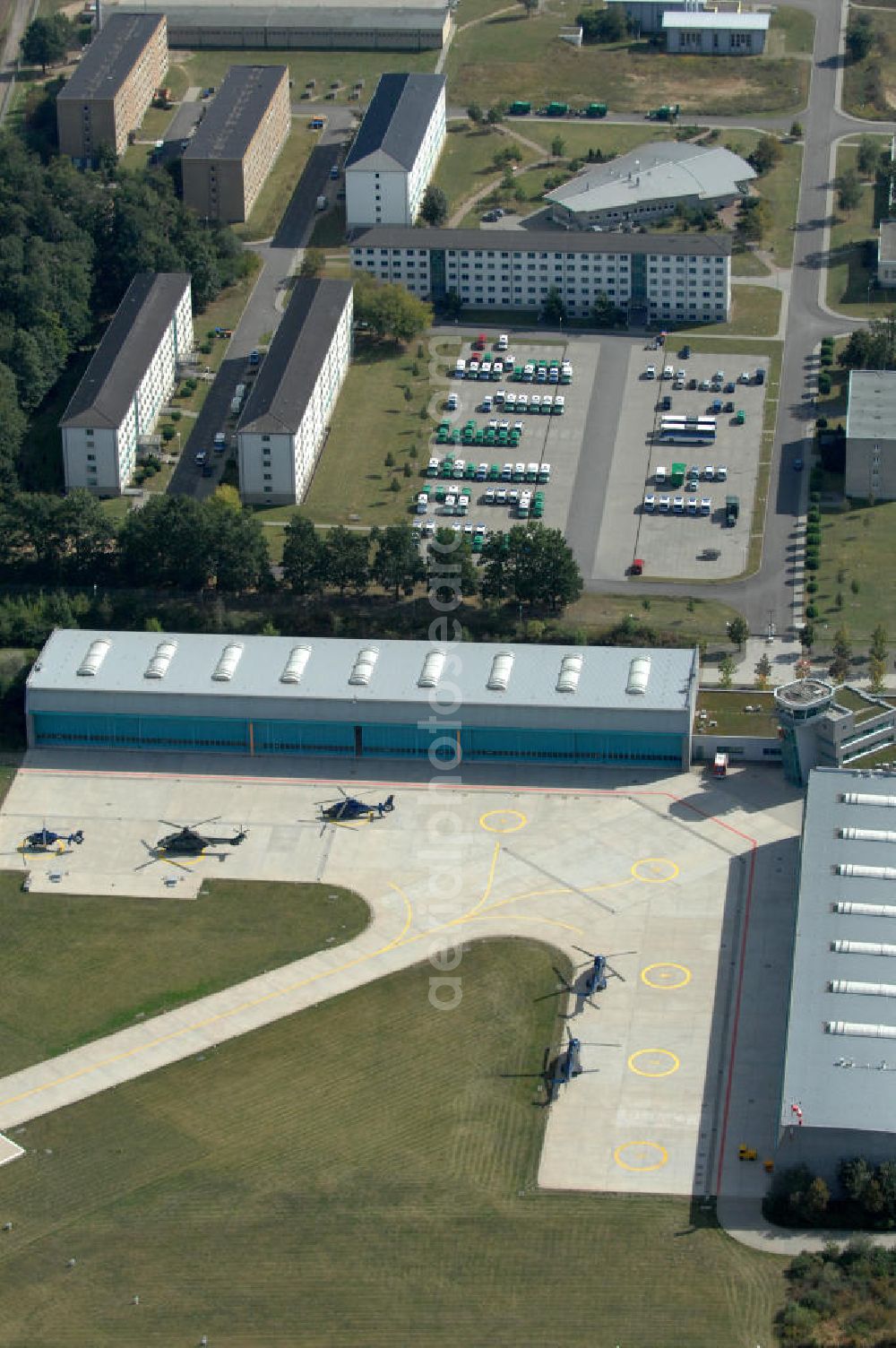 Aerial photograph Ahrensfelde - Blick auf das Areal der Bundespolizei-Fliegerstaffel Blumberg an der Neuer Schwanebecker Weg 3 in 16356 Ahrensfelde. Auf dem Gelände des Helikopterlandeplatzes am Berliner Stadtrand sind auch Maschinen der Regierungsfliegerstaffel stationiert. Am Standort erfolgt in den neu errichteten Hangars auch die Wartung und Reparatur der Flugtechnik.