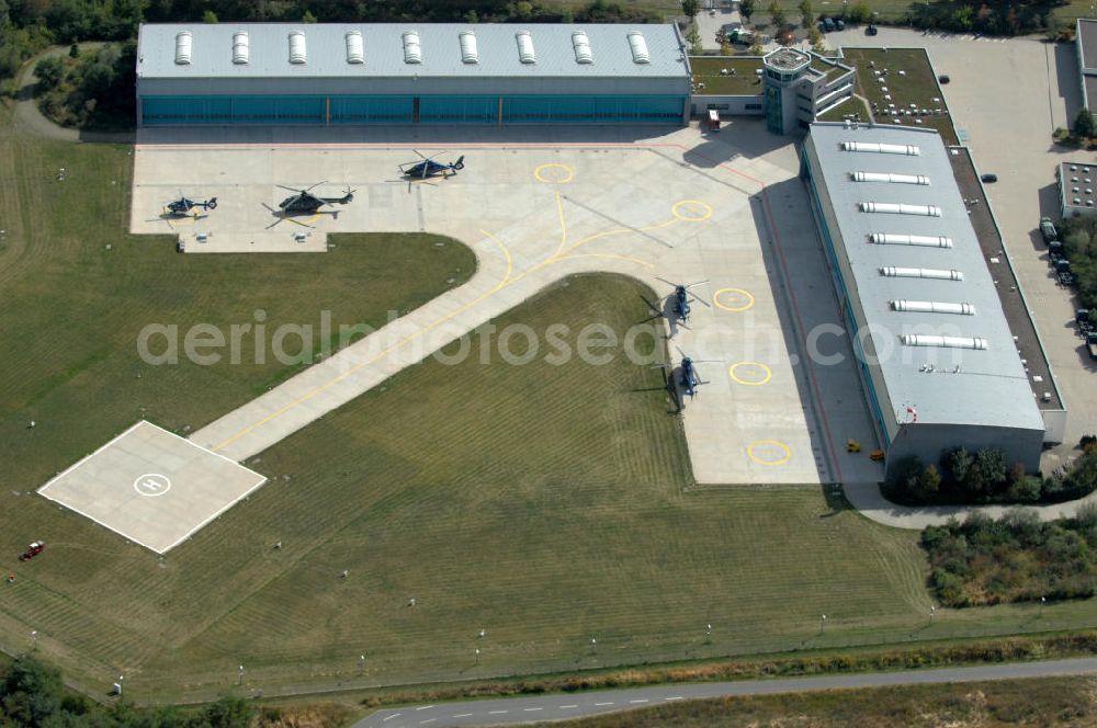 Ahrensfelde from the bird's eye view: Blick auf das Areal der Bundespolizei-Fliegerstaffel Blumberg an der Neuer Schwanebecker Weg 3 in 16356 Ahrensfelde. Auf dem Gelände des Helikopterlandeplatzes am Berliner Stadtrand sind auch Maschinen der Regierungsfliegerstaffel stationiert. Am Standort erfolgt in den neu errichteten Hangars auch die Wartung und Reparatur der Flugtechnik.