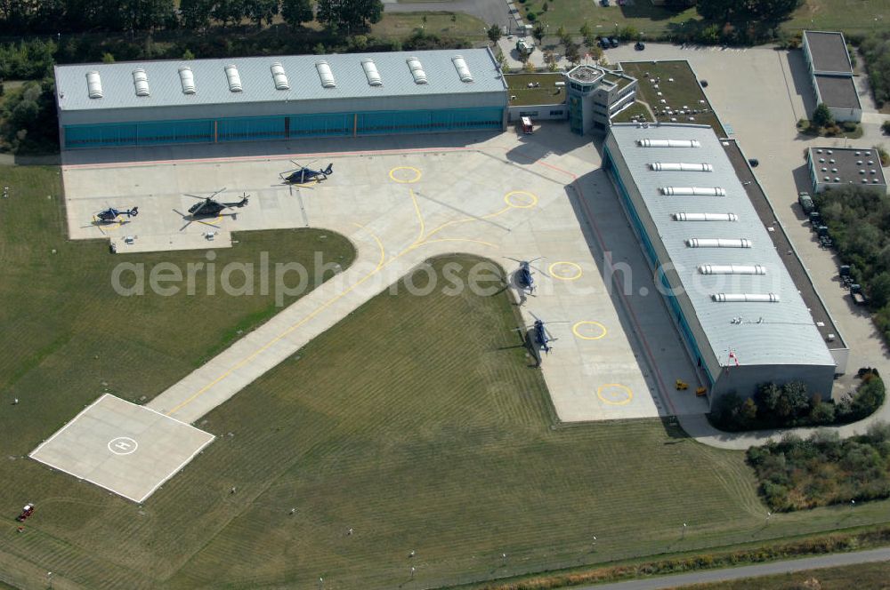 Aerial image Ahrensfelde - Blick auf das Areal der Bundespolizei-Fliegerstaffel Blumberg an der Neuer Schwanebecker Weg 3 in 16356 Ahrensfelde. Auf dem Gelände des Helikopterlandeplatzes am Berliner Stadtrand sind auch Maschinen der Regierungsfliegerstaffel stationiert. Am Standort erfolgt in den neu errichteten Hangars auch die Wartung und Reparatur der Flugtechnik.