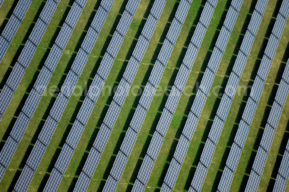 Aerial photograph Waldpolenz / Rote Jahne - Blick auf das Areal des neuen Solarparkes Rote Jahne, im Jahr 2007 speiste er bereits Strom im Wert von 2,1 Mio. Euro in das Stromnetz ein. Das ehemaligen Geländes des Flugplatz Eilenburg wurde in den 1930er Jahren gebaut. Zu DDR-Zeiten wurde er vom Ministerium für Staatssicherheit (MfS, Stasi) betrieben. Mit dem Anschluss an das Stromnetz hat die juwi solar GmbH aus Bolanden (Rheinland-Pfalz) nun den Bau des Solarprojektes Energiepark Waldpolenz im Landkreis Delitzsch nordöstlich??????????????????????????????????????????????????????????????????????????????????????????????????????????????????????????????????????????????????????????????????????????????????????????????????????????????????????????????????????????????????????????????????????????????????????????????????????????????????????????????????????????????????????????????????????????????????????