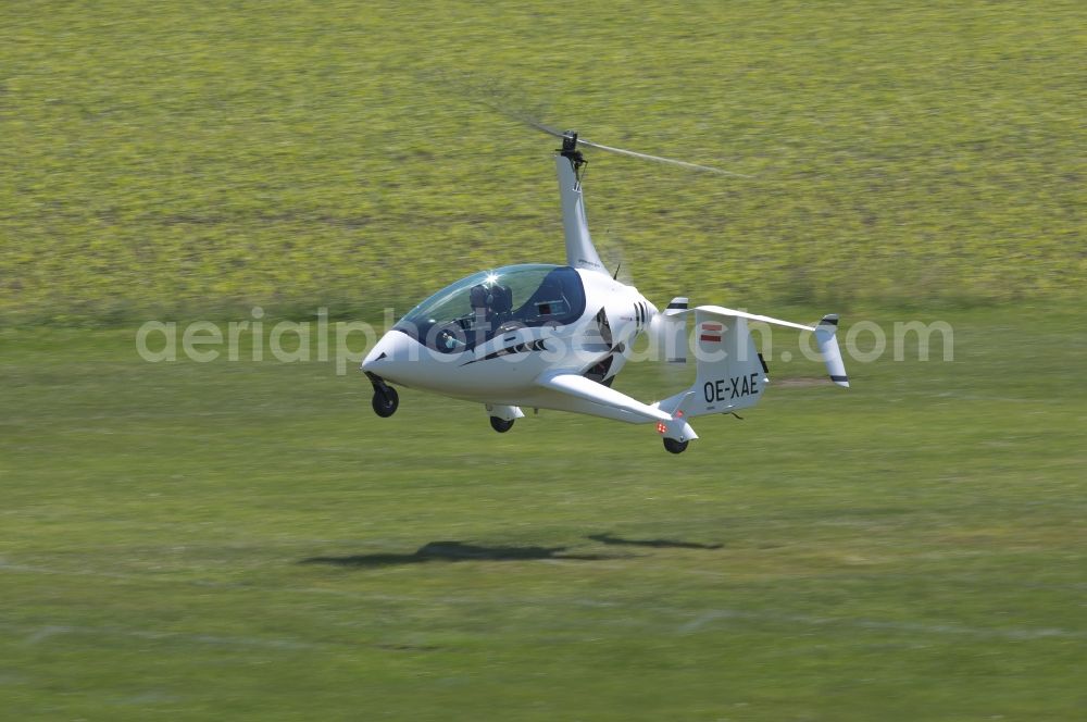 Amstetten from the bird's eye view: Arrow Copter AC20 helicopter in flight at Amstetten in Austria