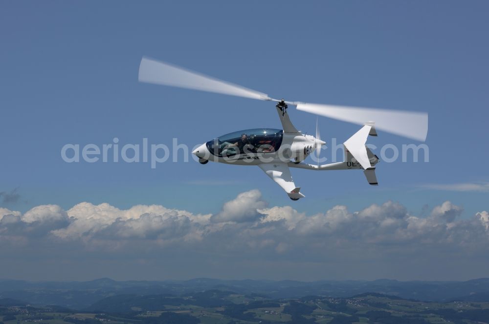 Aerial photograph Amstetten - Arrow Copter AC20 helicopter in flight at Amstetten in Austria