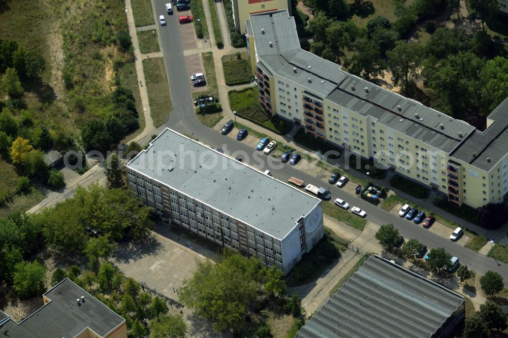 Berlin from above - Home for asylum seekers in a former school building in the district of Marzahn-Hellersdorf in Berlin in Germany. The former Max-Rheinhardt-School is located amidst concrete slab buildings and residential estates on Carola-Neher-Street