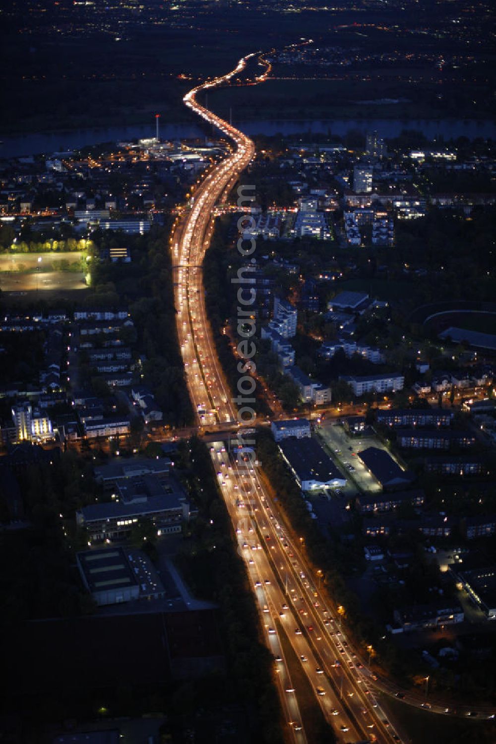 Aerial image at night Bonn - Blick über die Autobahn A565 in Bonn bei Nacht. Im Hintergrund die Friedrich-Ebert-Brücke über den Rhein. View of the motorway A565 in Bonn during the night. In the background the Friedrich Ebert Bridge over the Rhine.