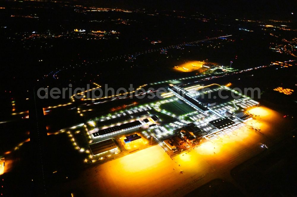 Aerial image at night Schkeuditz - Night lighting Dispatch building and terminals on the premises of the airport of Flughafen Leipzig/Halle GmbH in Schkeuditz in the state Saxony, Germany