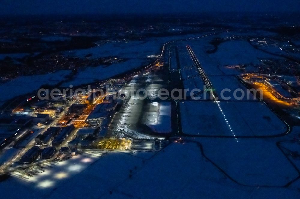 Aerial photograph at night Stuttgart - Night lighting dispatch building and terminals on the premises of the airport in Stuttgart in the state Baden-Wuerttemberg