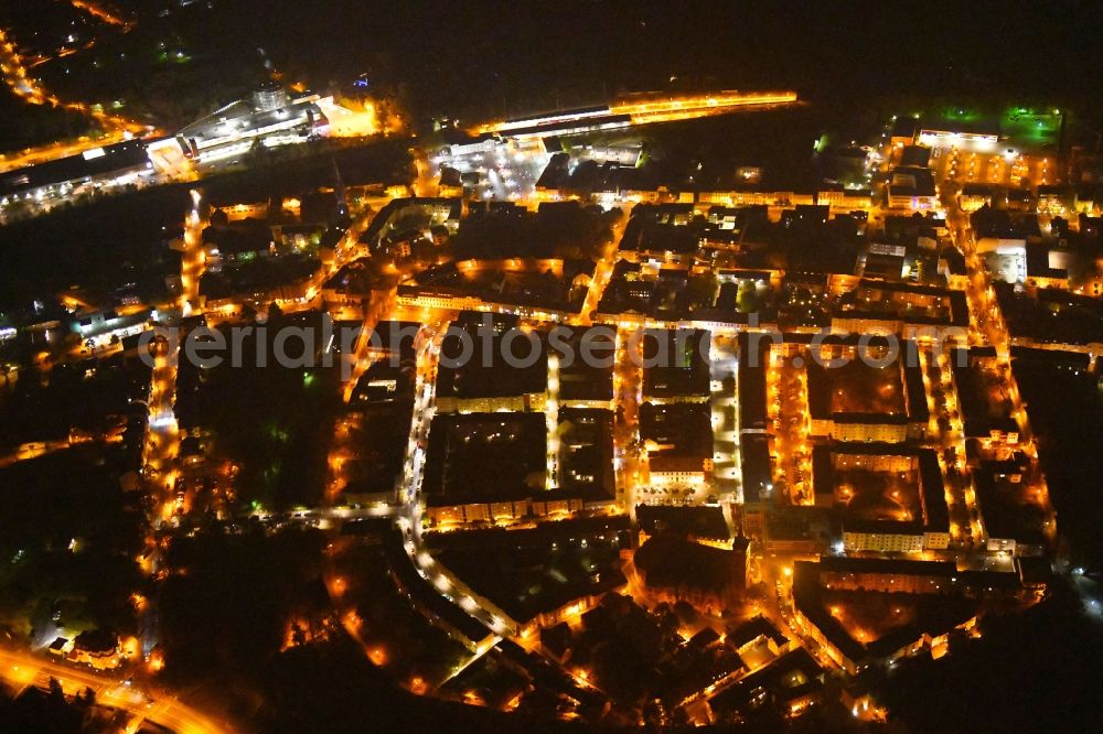 Bernau at night from the bird perspective: Night lighting Old Town area and city center in Bernau in the state Brandenburg, Germany