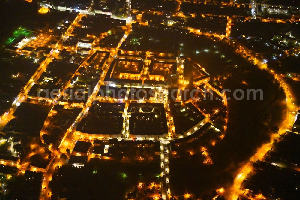 Bernau at night from the bird perspective: Night lighting Old Town area and city center in Bernau in the state Brandenburg, Germany