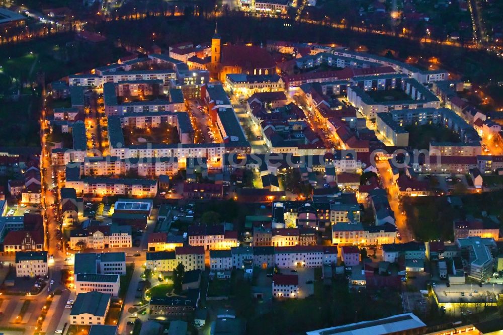 Bernau at night from the bird perspective: Night lighting old Town area and city center in Bernau in the state Brandenburg, Germany