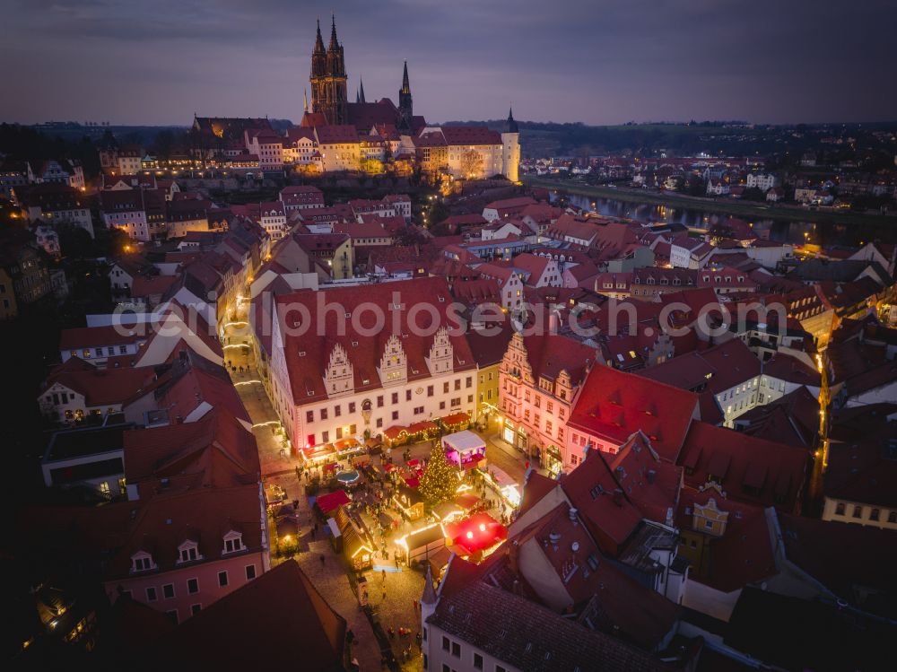 Meißen at night from the bird perspective: Night lights and illumination Christmas market in the old town area and city center in Meissen in the state of Saxony, Germany