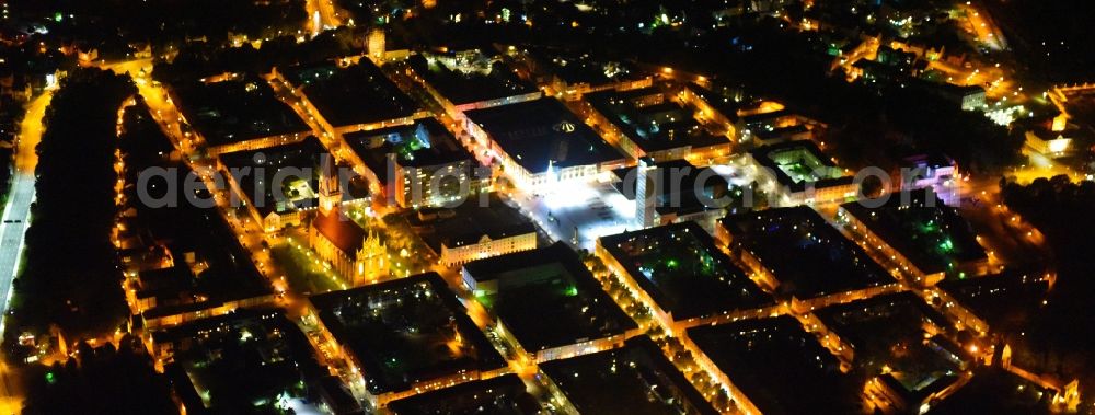 Aerial image at night Neubrandenburg - Night lighting Old Town area and city center in Neubrandenburg in the state Mecklenburg - Western Pomerania, Germany