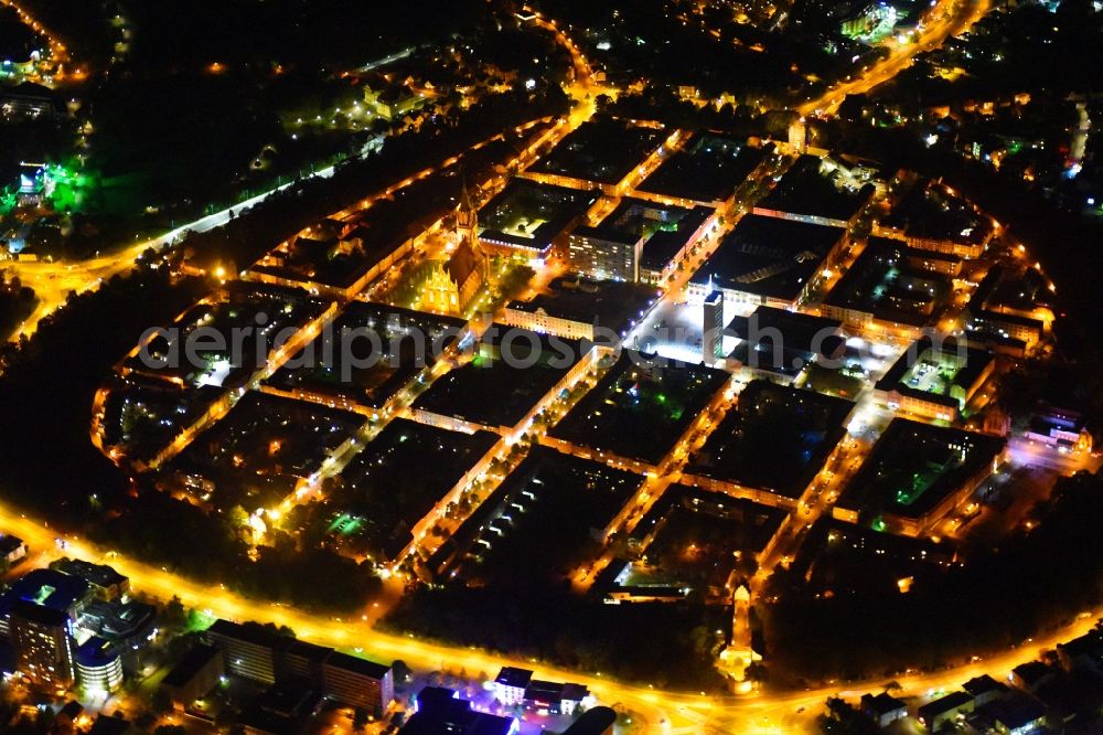 Aerial image at night Neubrandenburg - Night lighting Old Town area and city center in Neubrandenburg in the state Mecklenburg - Western Pomerania, Germany