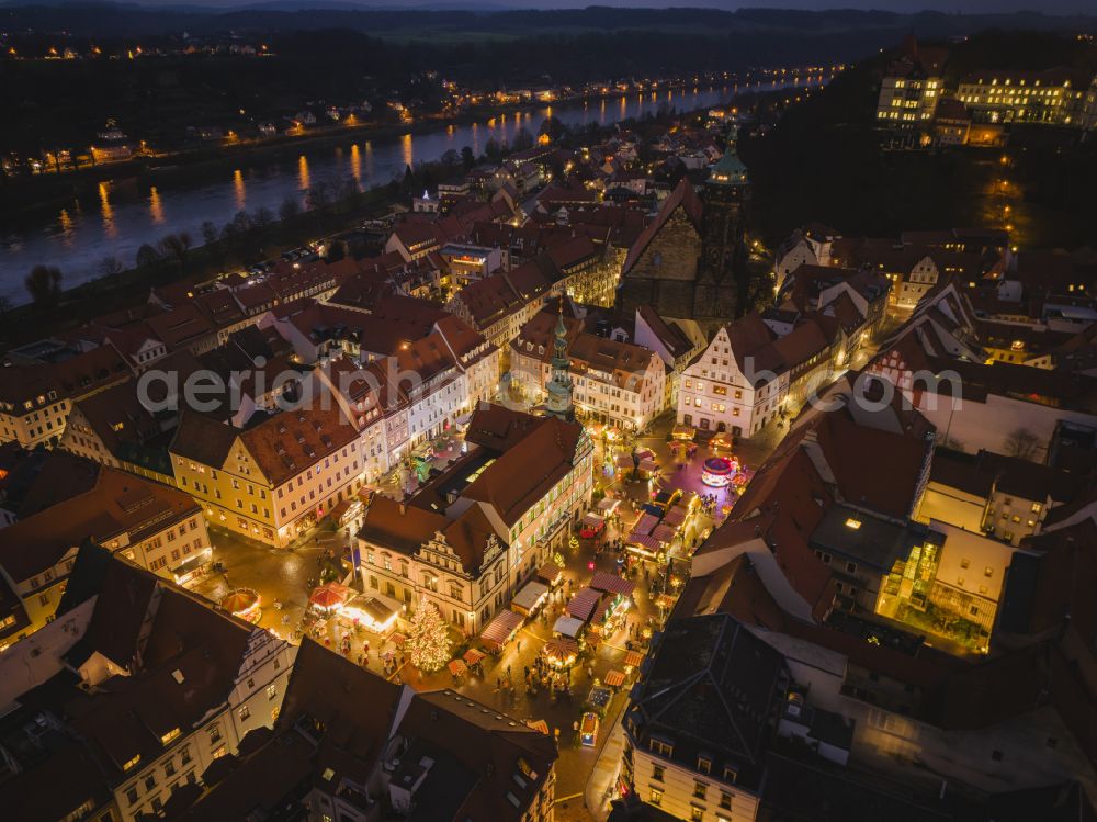 Aerial image at night Pirna - Night lights and illumination Christmas market Canalettomarkt in the old town area and city center in Pirna in the federal state of Saxony, Germany