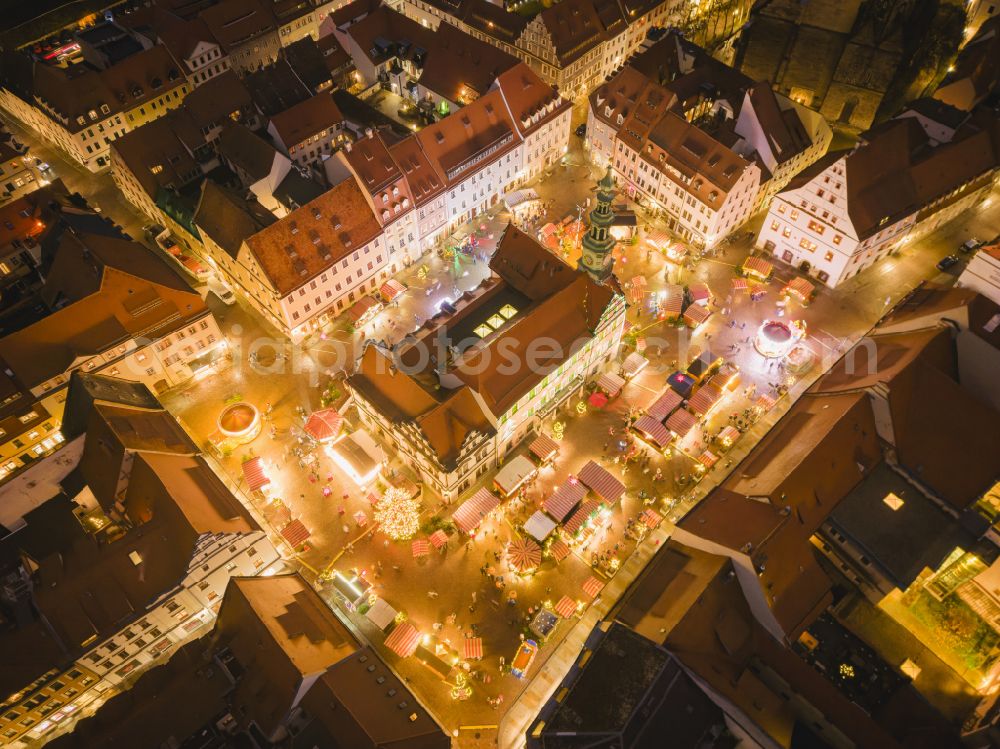 Pirna at night from the bird perspective: Night lights and illumination Christmas market Canalettomarkt in the old town area and city center in Pirna in the federal state of Saxony, Germany