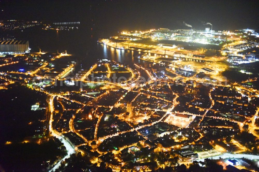 Aerial image at night Wismar - Night lighting Old Town area and city center in Wismar in the state Mecklenburg - Western Pomerania, Germany