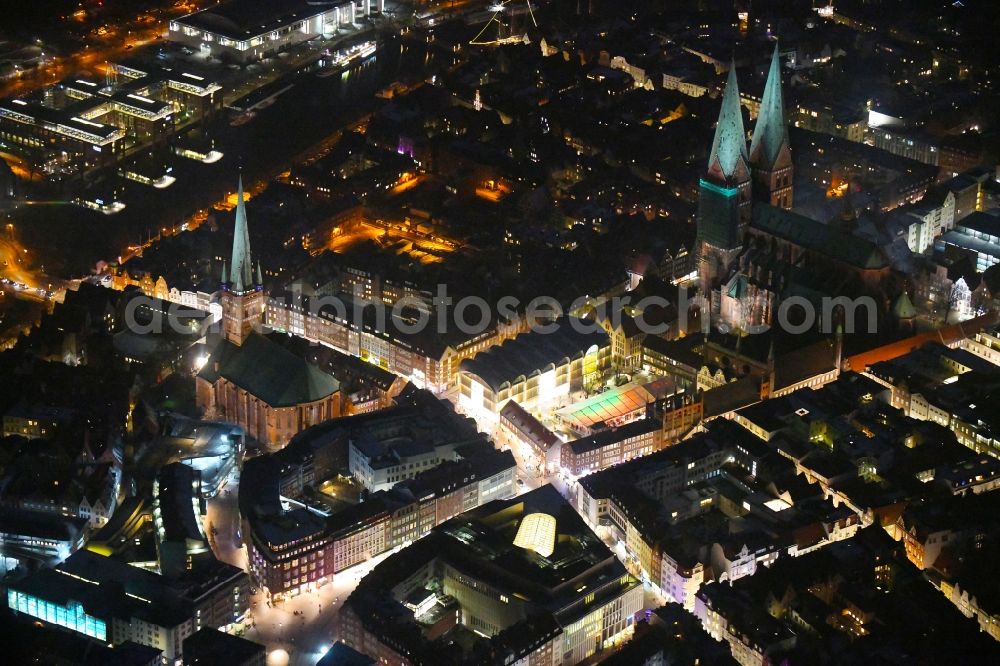 Lübeck at night from above - Night lighting old Town area and city center between St. Petri Kirche, Markt and Marienkirche in the district Innenstadt in Luebeck in the state Schleswig-Holstein, Germany