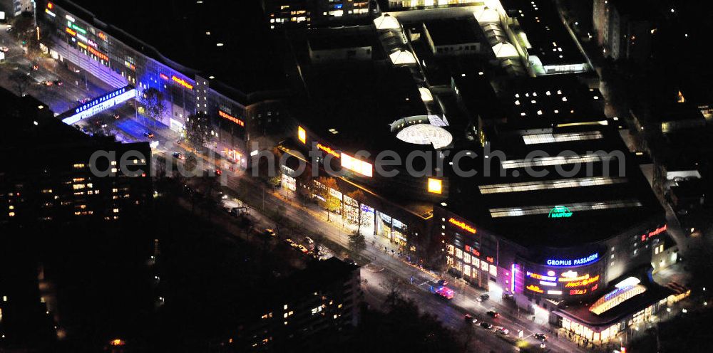 Aerial image at night Berlin - Nachtluftbild auf die Gropiusstadt und die Gropius-Passagen. Die Passagen wurden 1994 eröffnet und gelten als das größte Einkaufszentrum in Deutschland. Investor ist der Unternehmer Harald Huth ( HFS Immobilien ). View to the Berlin district Neukölln with the shopping center Gropius Passagen.