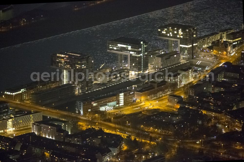 Köln at night from above - Night view of new construction of houses on the crane Rheinauhafen on the banks of the Rhine in Cologne in North Rhine-Westphalia