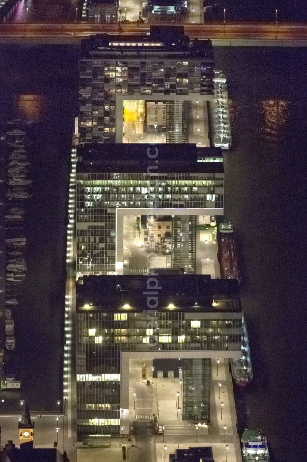 Köln at night from above - Night view of new construction of houses on the crane Rheinauhafen on the banks of the Rhine in Cologne in North Rhine-Westphalia