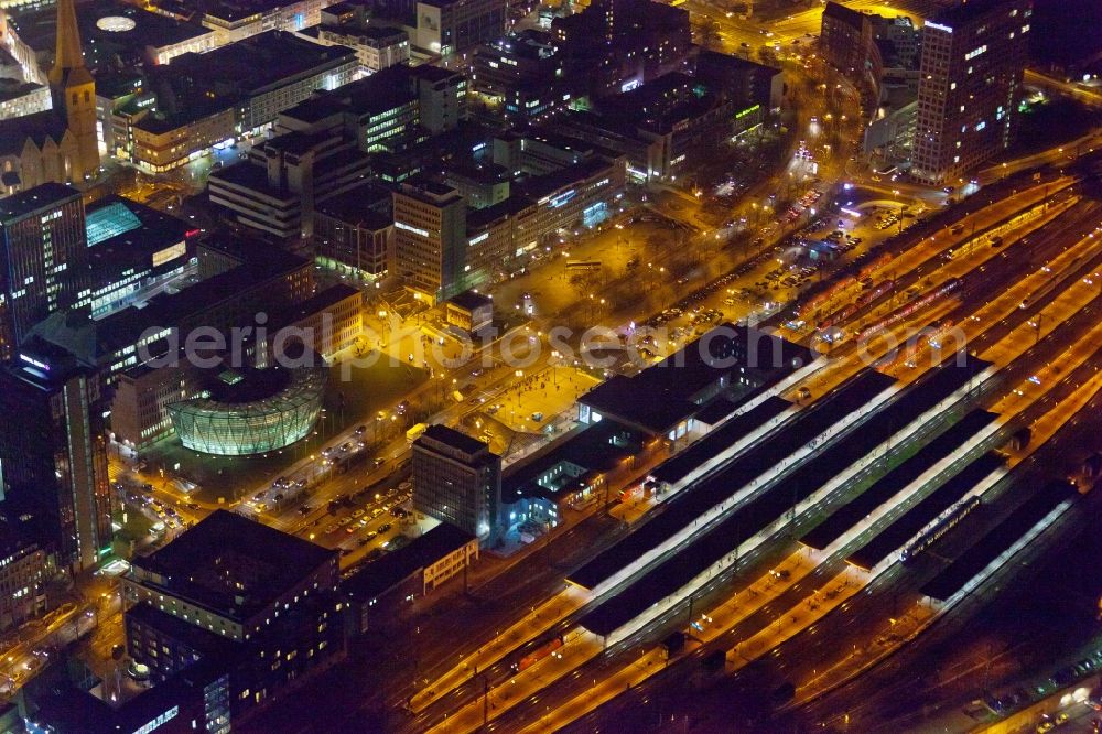 Aerial photograph at night Dortmund - Night aerial photography of the city center - the center at Dortmund's central station. The picture shows the area at the King Wall, Station Road and the residential and commercial buildings in the city and the Library of Dortmund