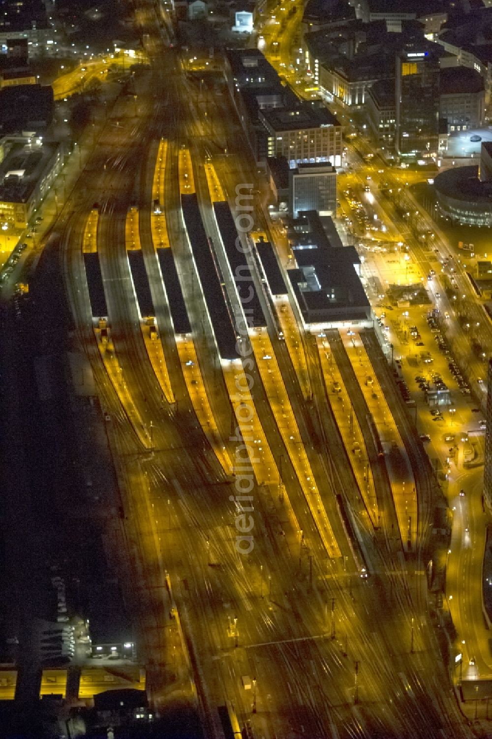 Dortmund at night from above - Night aerial photography of the city center - the center at Dortmund's central station. The picture shows the area at the King Wall, Station Road and the residential and commercial buildings in the city and the Library of Dortmund