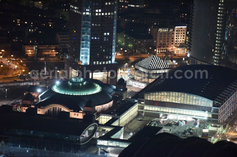 Frankfurt am Main at night from above - Night view Exhibition grounds and exhibition halls of the Messe Frankfurt on Ludwig-Erhard-Anlage in Frankfurt in the state Hesse