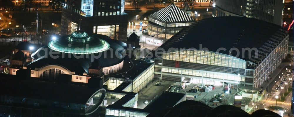 Frankfurt am Main at night from the bird perspective: Night view Exhibition grounds and exhibition halls of the Messe Frankfurt on Ludwig-Erhard-Anlage in Frankfurt in the state Hesse