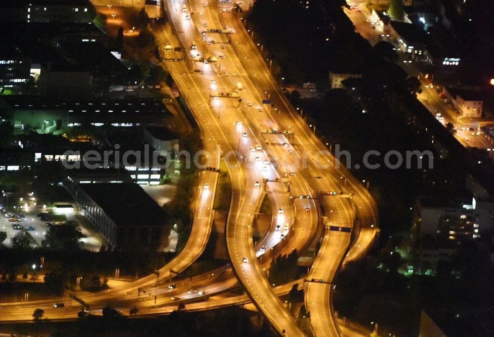 Aerial photograph at night Berlin - Night view routing and traffic lanes during the highway exit and access the motorway A 100 - 113 Grenzallee destrict Neukoelln in Berlin