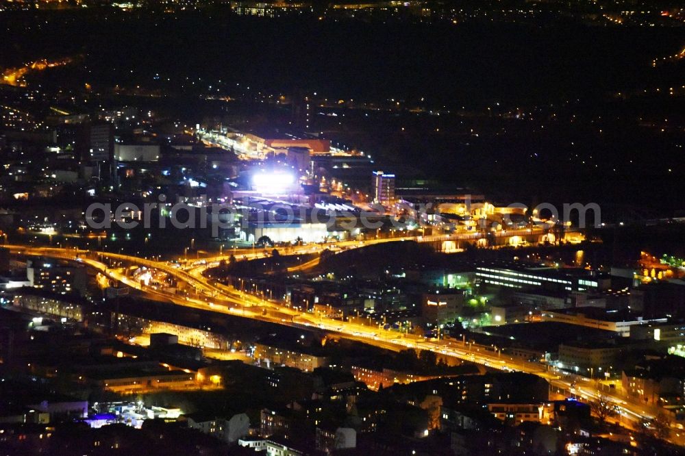 Aerial image at night Berlin - Night view routing and traffic lanes during the highway exit and access the motorway A 100 - 113 Grenzallee destrict Neukoelln in Berlin