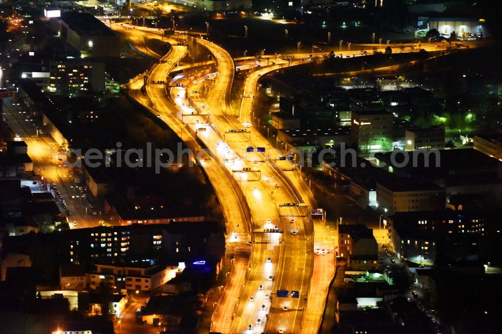 Berlin at night from above - Night view routing and traffic lanes during the highway exit and access the motorway A 100 - 113 Grenzallee destrict Neukoelln in Berlin