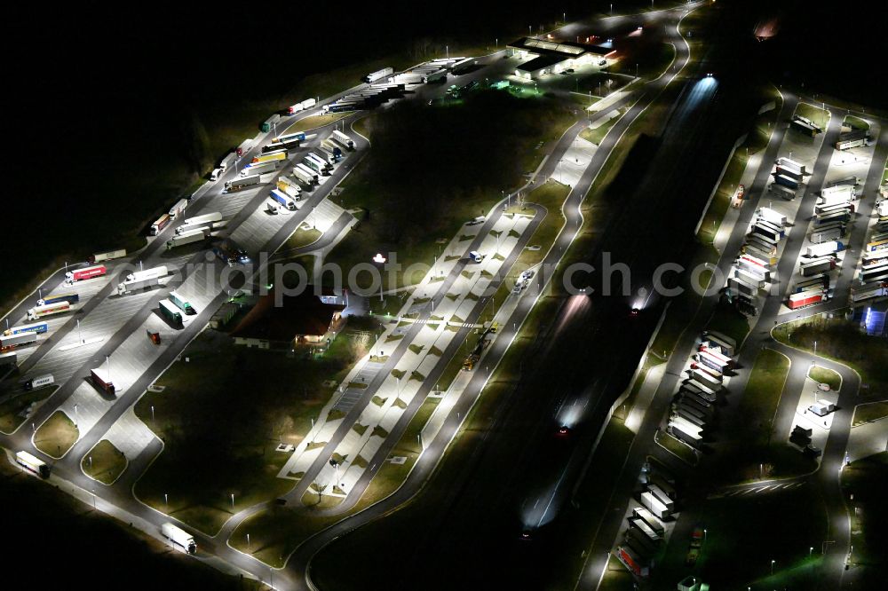 Krauschwitz at night from above - Night lighting routing and traffic lanes during the motorway service station and parking lot of the BAB A 9 - Osterfeld West in Krauschwitz in the state Saxony-Anhalt, Germany