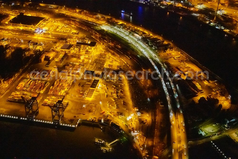 Hamburg at night from the bird perspective: Night lighting highway route BAB A7 in in the district Waltershof in Hamburg, Germany