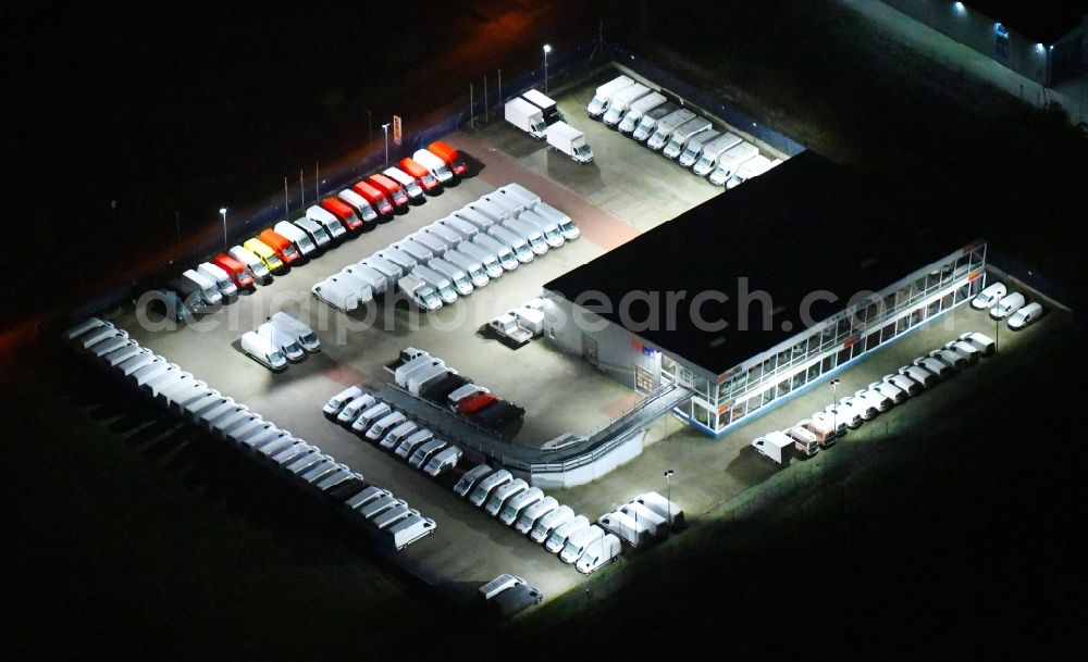 Aerial image at night Siek - Night lighting car dealership building ACR GmbH in Siek in the state Schleswig-Holstein, Germany