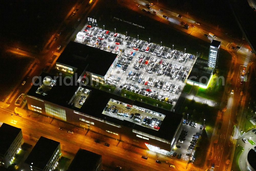 Berlin at night from above - Night lighting Car dealership building Audi Zentrum Adlershof on Rudower Strasse in the district Adlershof in Berlin, Germany